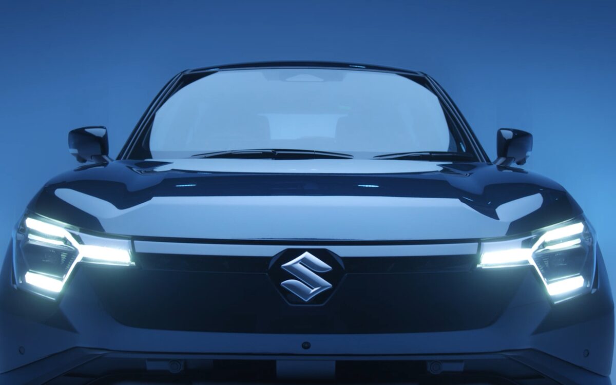 Front view of the e Vitara with its three-point LED daytime running lights and Suzuki emblem