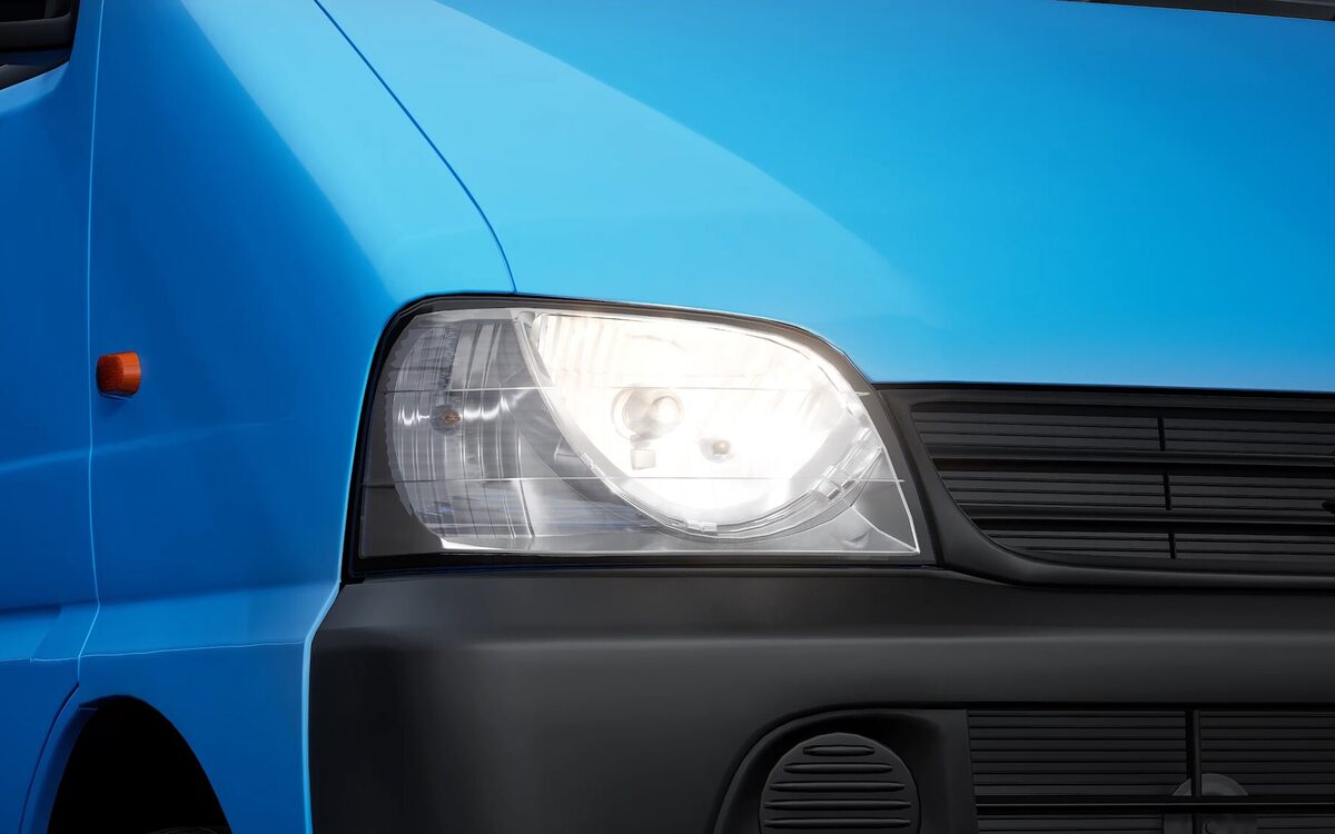 Close-up of the Eeco headlamp and grille on a blue body