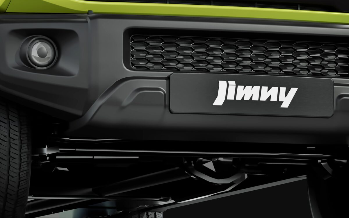 Close-up of the Jimny front bumper with fog lamp and Jimny badge