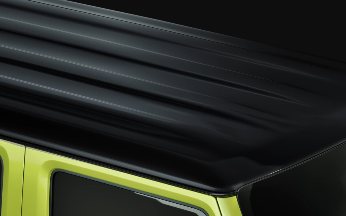 Close-up of the Jimny black roof and top edge of the yellow body