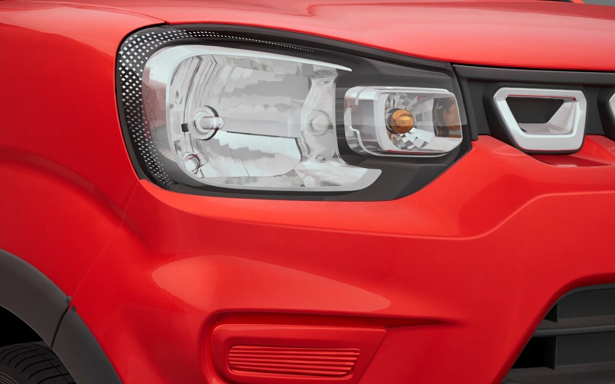 Close-up of the S-Presso headlamp and front grille on a red body