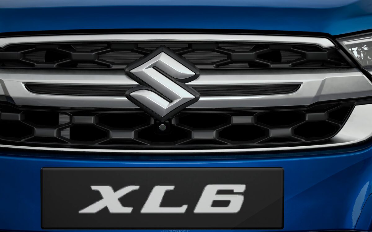 Close-up of the XL6 chrome front grille with the Suzuki logo and XL6 badge