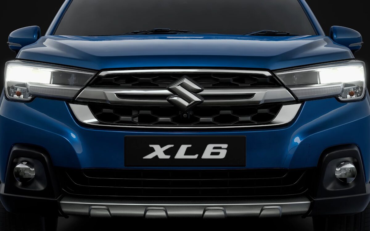 Front view of the XL6 showing the LED headlamps, grille and skid plate on a dark background