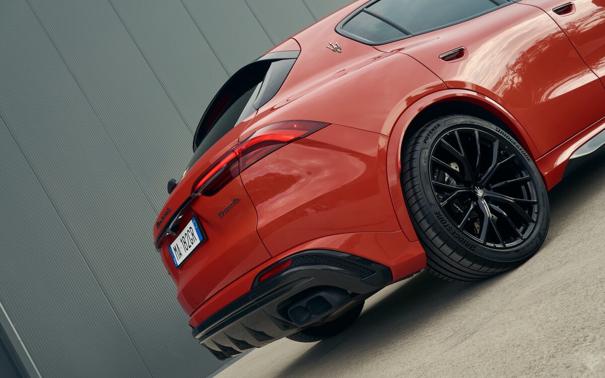 Red Maserati Grecale seen from the rear three-quarter angle