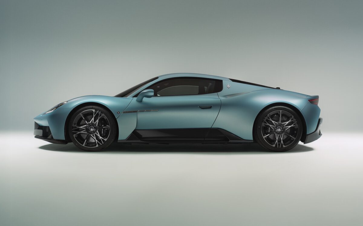 Maserati MCPURA in teal, side profile in a grey studio