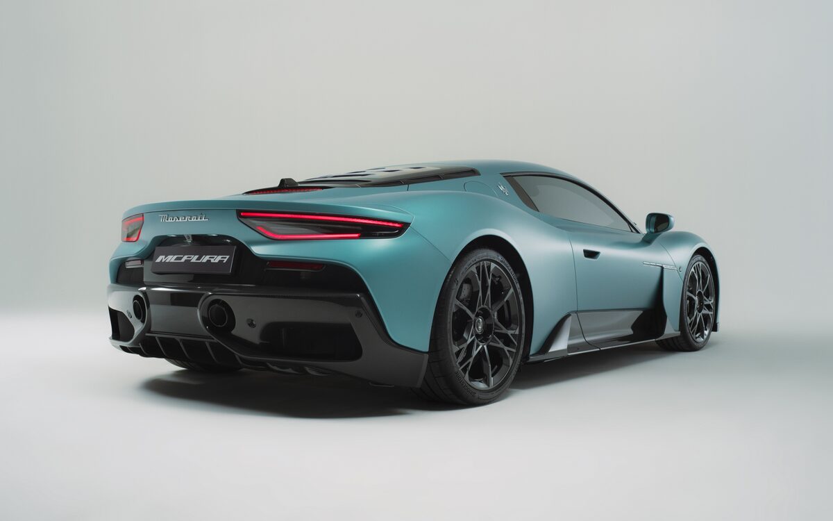 Maserati MCPURA in teal, rear three-quarter view in a studio