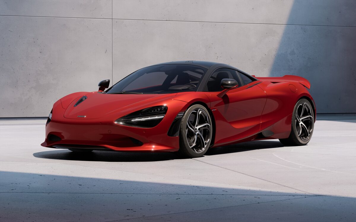 McLaren 750S in red, front three-quarter view in a studio-style setting
