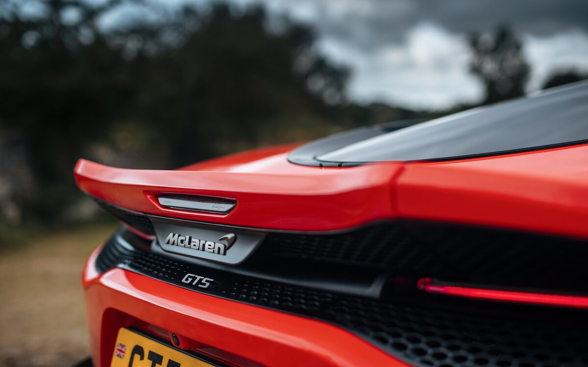 Close-up of the GTS badge and rear spoiler of the orange GTS