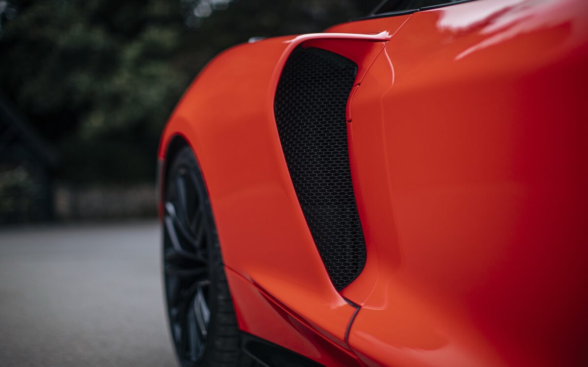 Close-up of the side air intake on the orange GTS