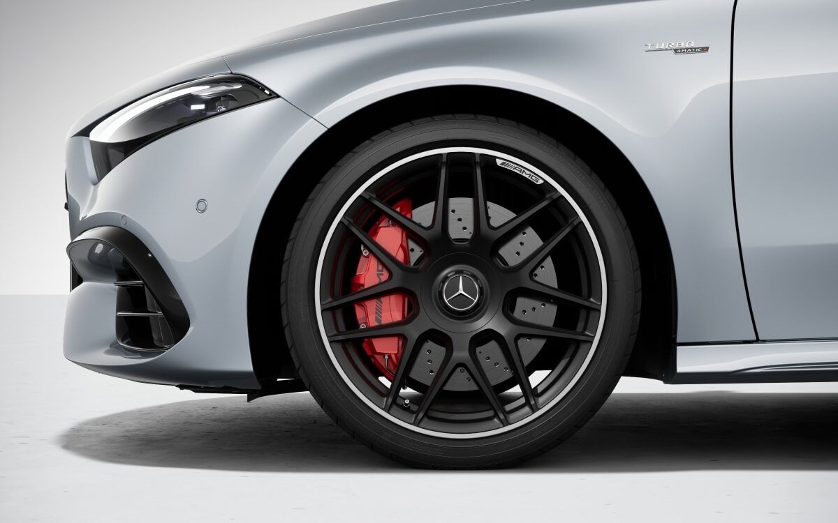 Close-up of the black AMG alloy wheel with red brake calliper on the Mercedes-AMG A-Class