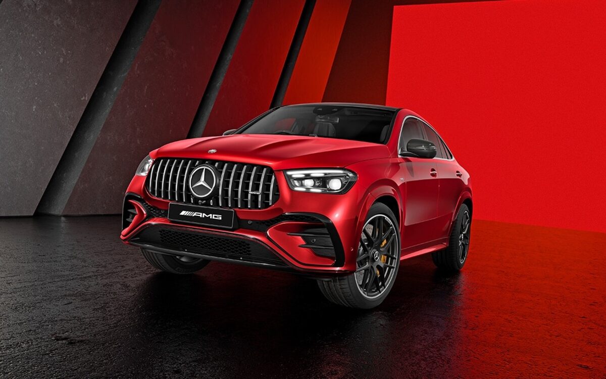 Mercedes-AMG GLE 53 Coupe in red, front three-quarter view in a dark studio with red backdrop