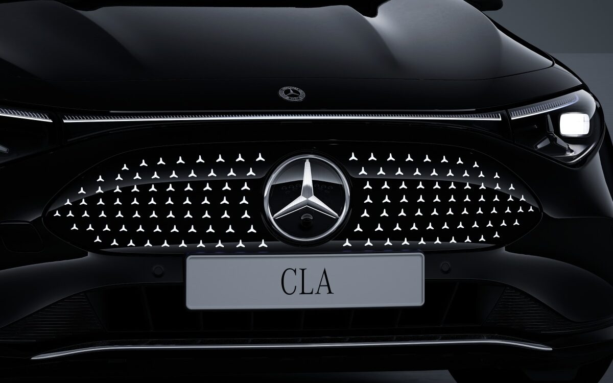 Front grille of a black Mercedes-Benz CLA with the illuminated star pattern