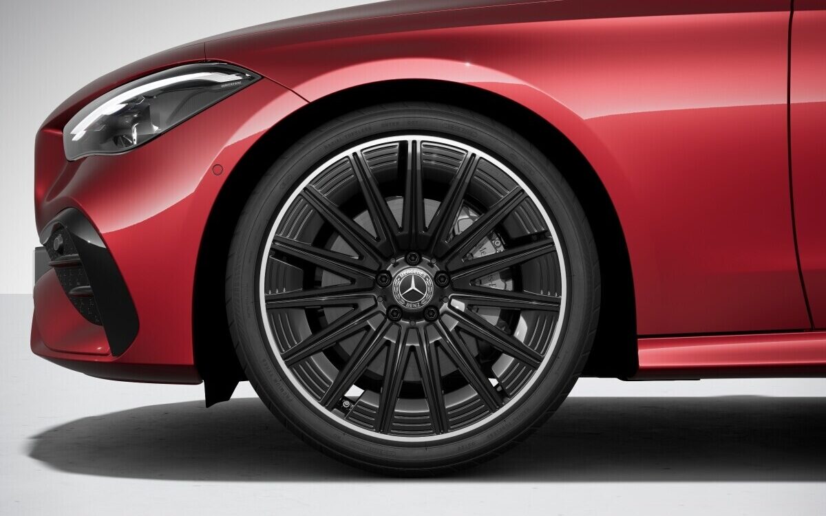 Close-up of the AMG multi-spoke alloy wheel and front wing of a red CLE Cabriolet