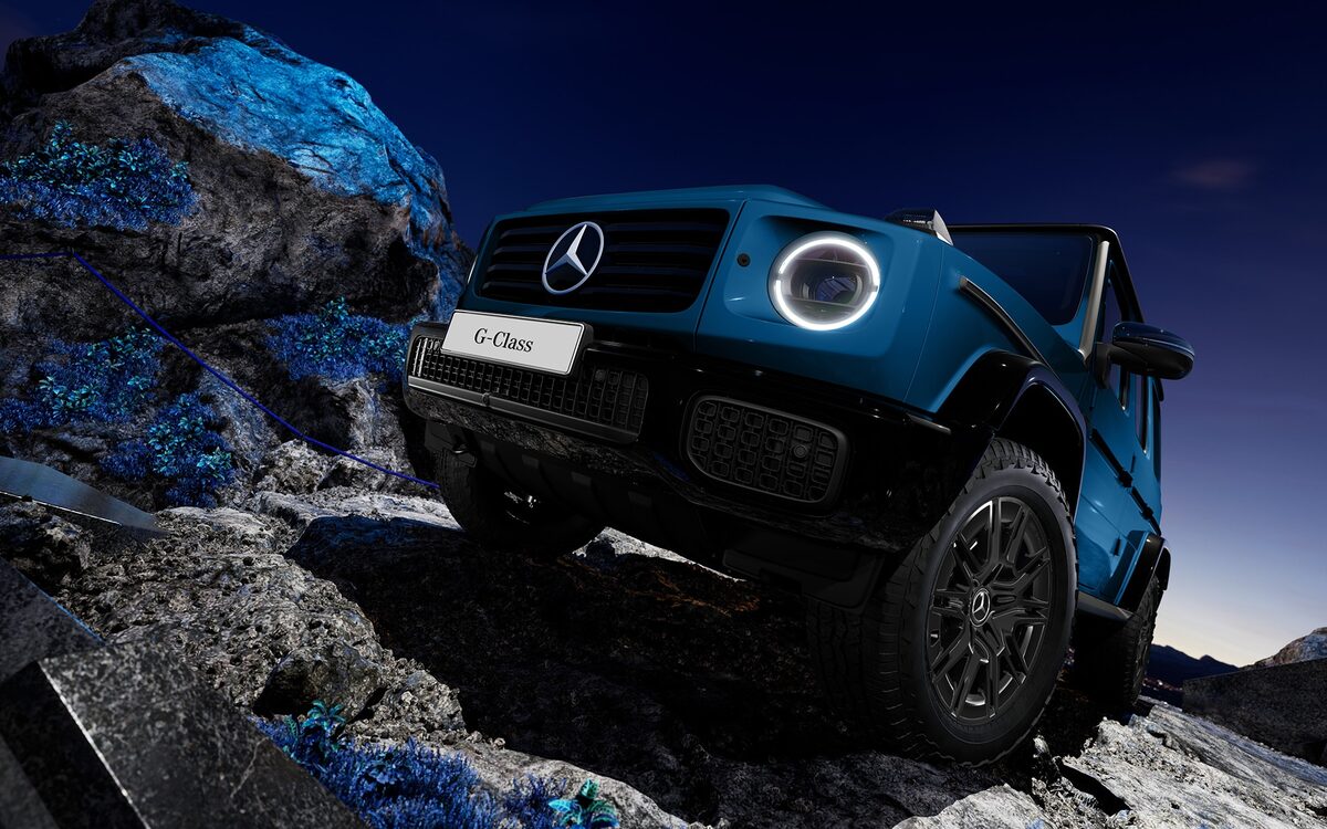 Blue G 580 with EQ Technology photographed from a low angle on rocks, circular LED headlamp glowing