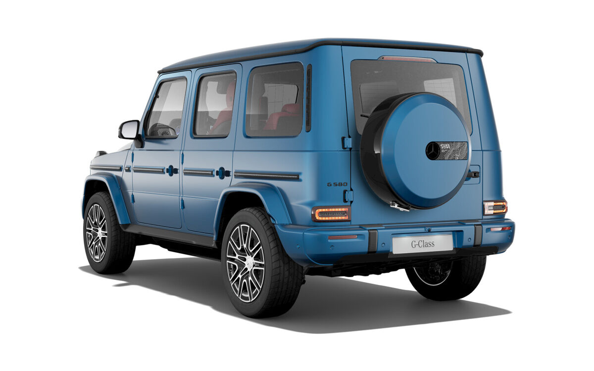G 580 with EQ Technology in blue, rear three-quarter view showing the round spare wheel cover on a white background