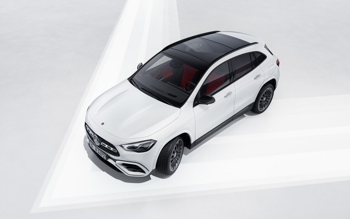 Mercedes-Benz GLA in white seen from above and the front, showing the dark glass roof