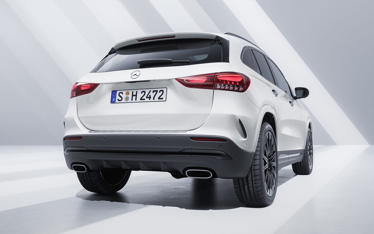 Mercedes-Benz GLA in white, rear three-quarter view with LED tail lamps in a bright studio