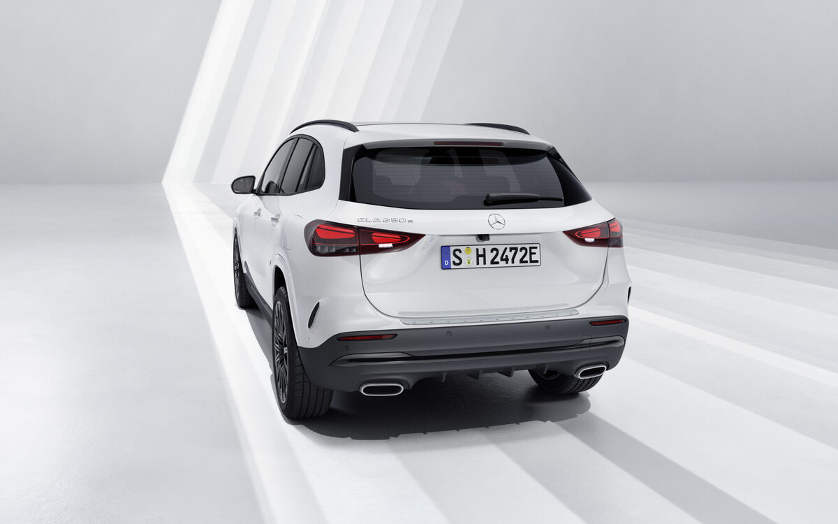 Mercedes-Benz GLA in white seen straight from behind with tail lamps and twin exhaust trims
