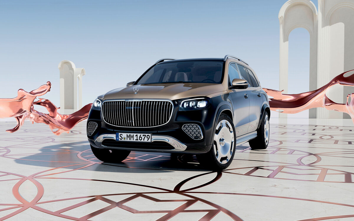 Mercedes-Maybach GLS in black and champagne two-tone, front three-quarter view on a white studio floor