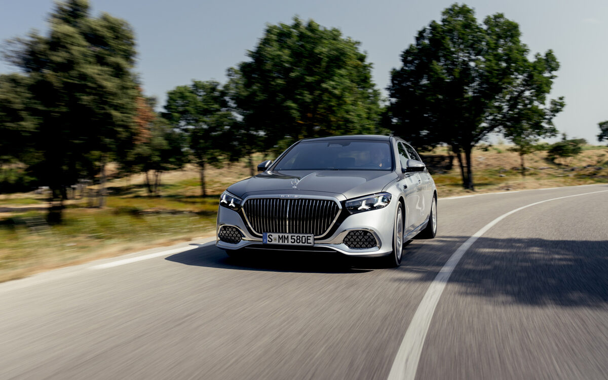 Silver Mercedes-Maybach S-Class driving towards the camera on a country road