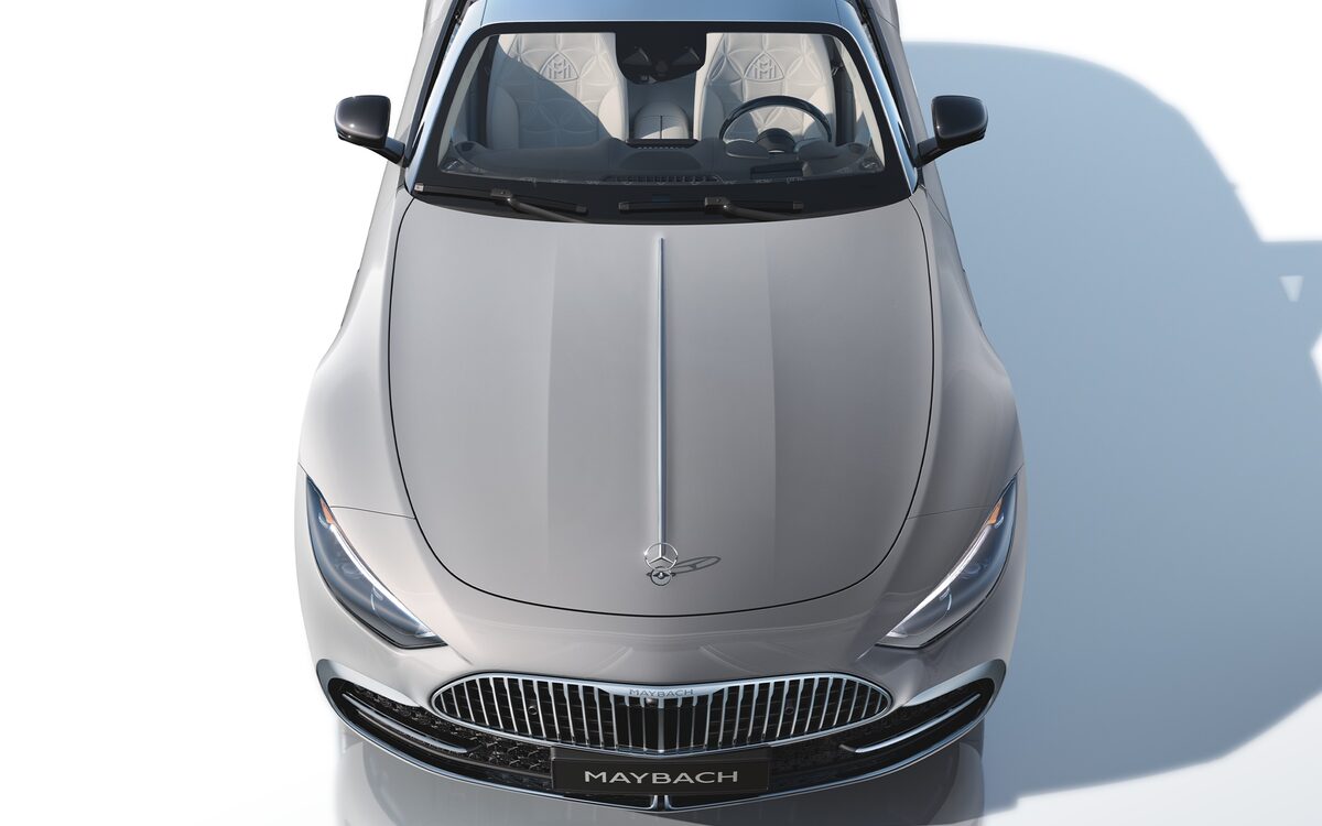 Silver-grey Mercedes-Maybach SL seen from above and the front, showing the Maybach grille, bonnet ornament and open cabin