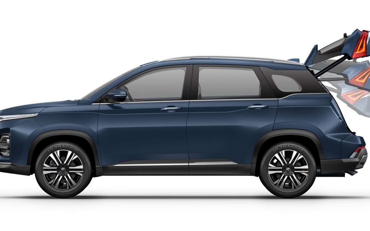 MG Hector in Celadon Blue, side profile on a white studio background with the powered tailgate shown opening