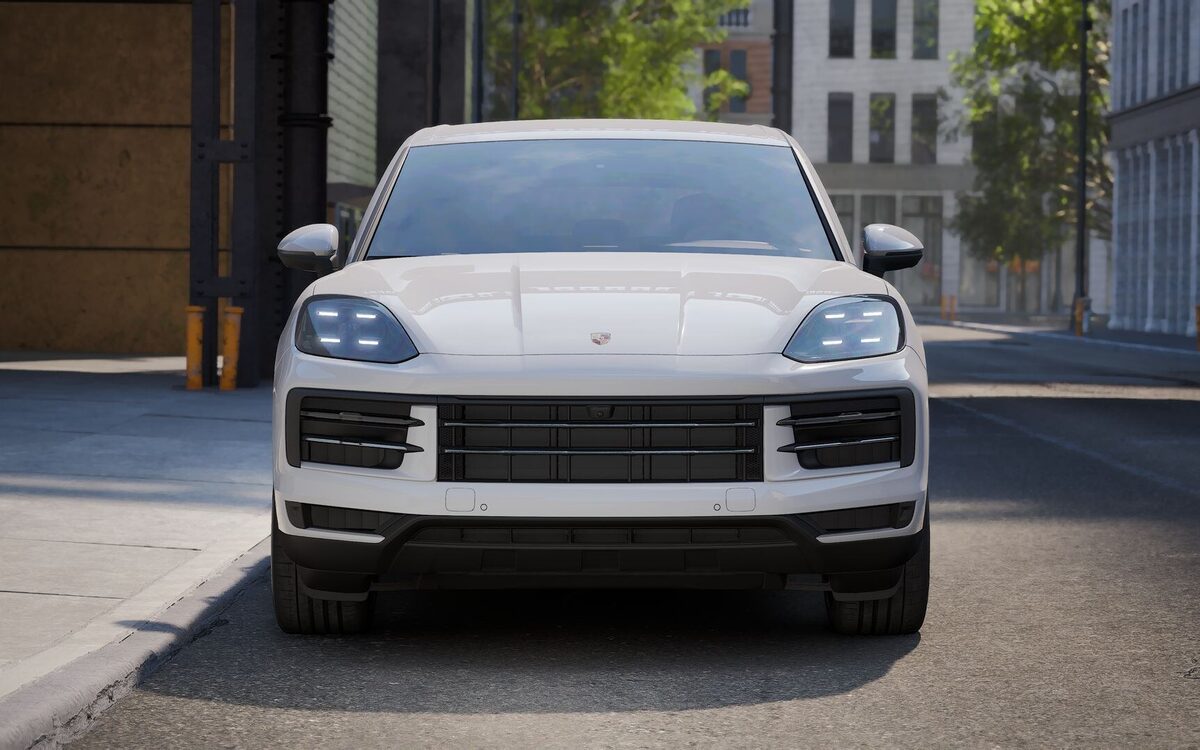 Porsche Cayenne in white, straight front view showing the grille and matrix LED headlamps