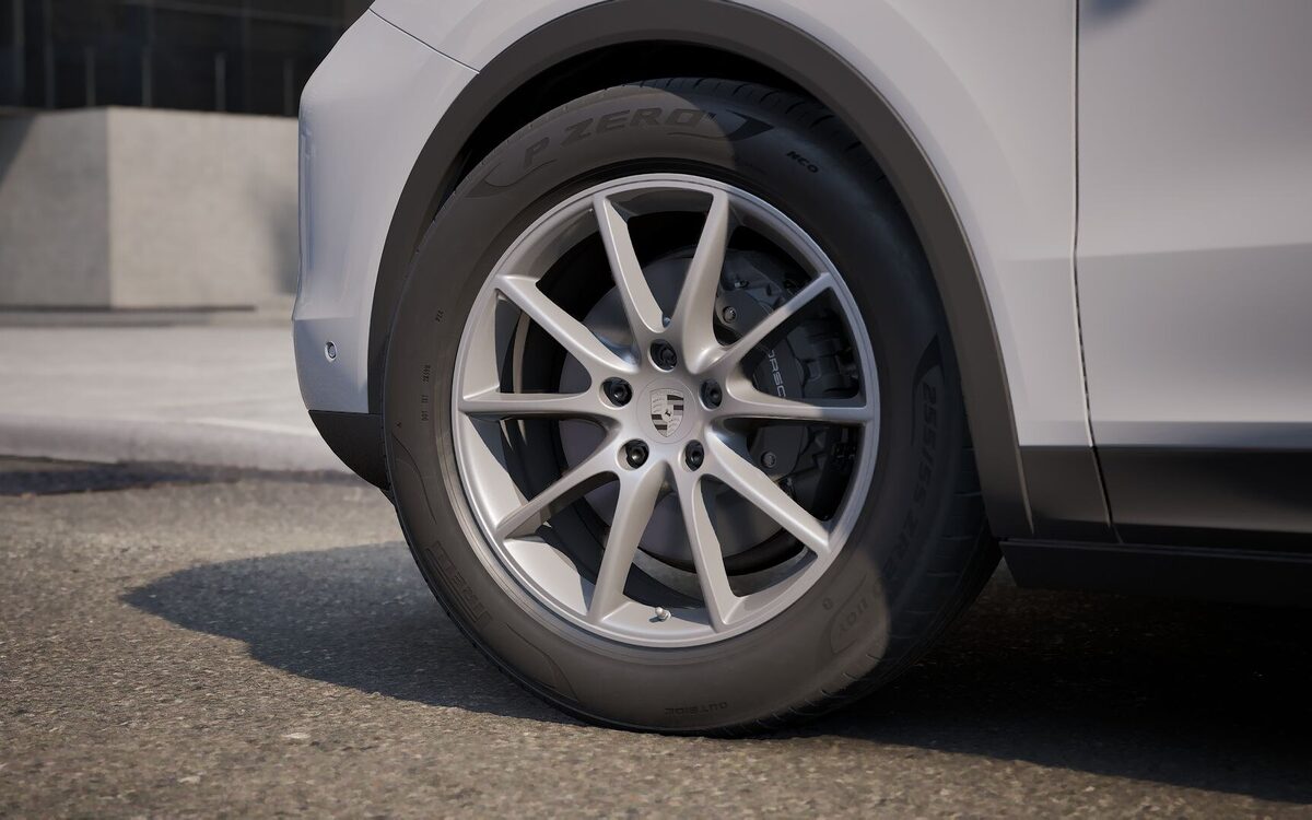 Close-up of a Porsche Cayenne silver alloy wheel with brake caliper