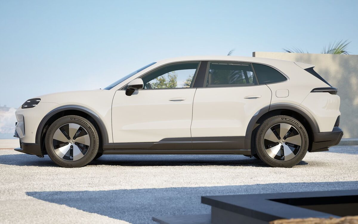 Porsche Cayenne Electric in white, side profile on a gravel forecourt