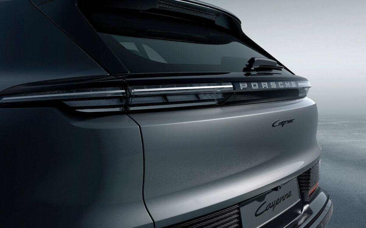 Close-up of the Porsche Cayenne Electric rear light strip and badge