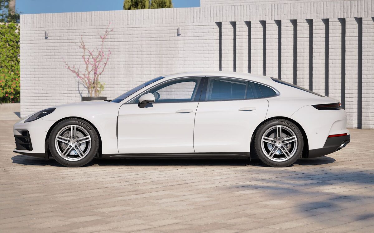 Porsche Panamera in white, side profile parked on paving stones
