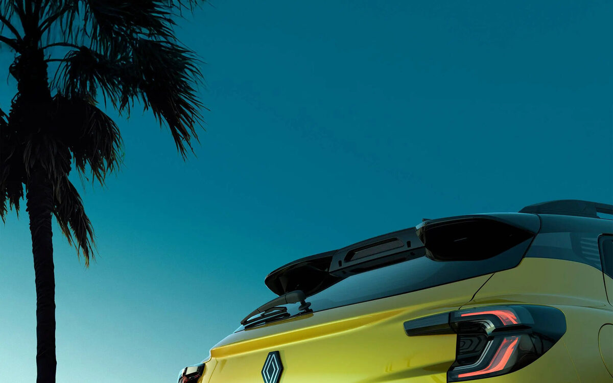Rear of the Renault Kiger in Oasis Yellow showing the tail lamp, spoiler and Kiger badge