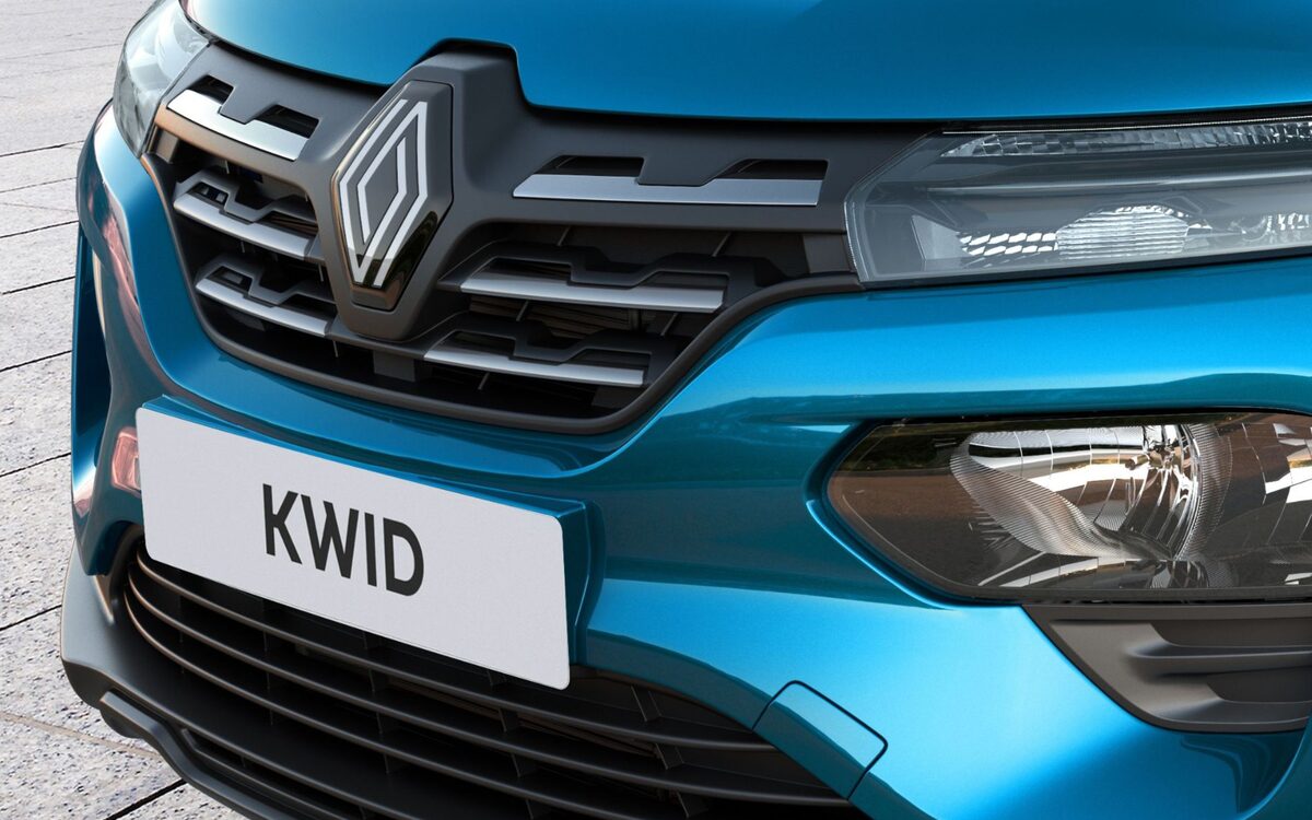 Close-up of the blue Renault Kwid front end showing the grille, Renault diamond logo, headlamp and KWID nameplate