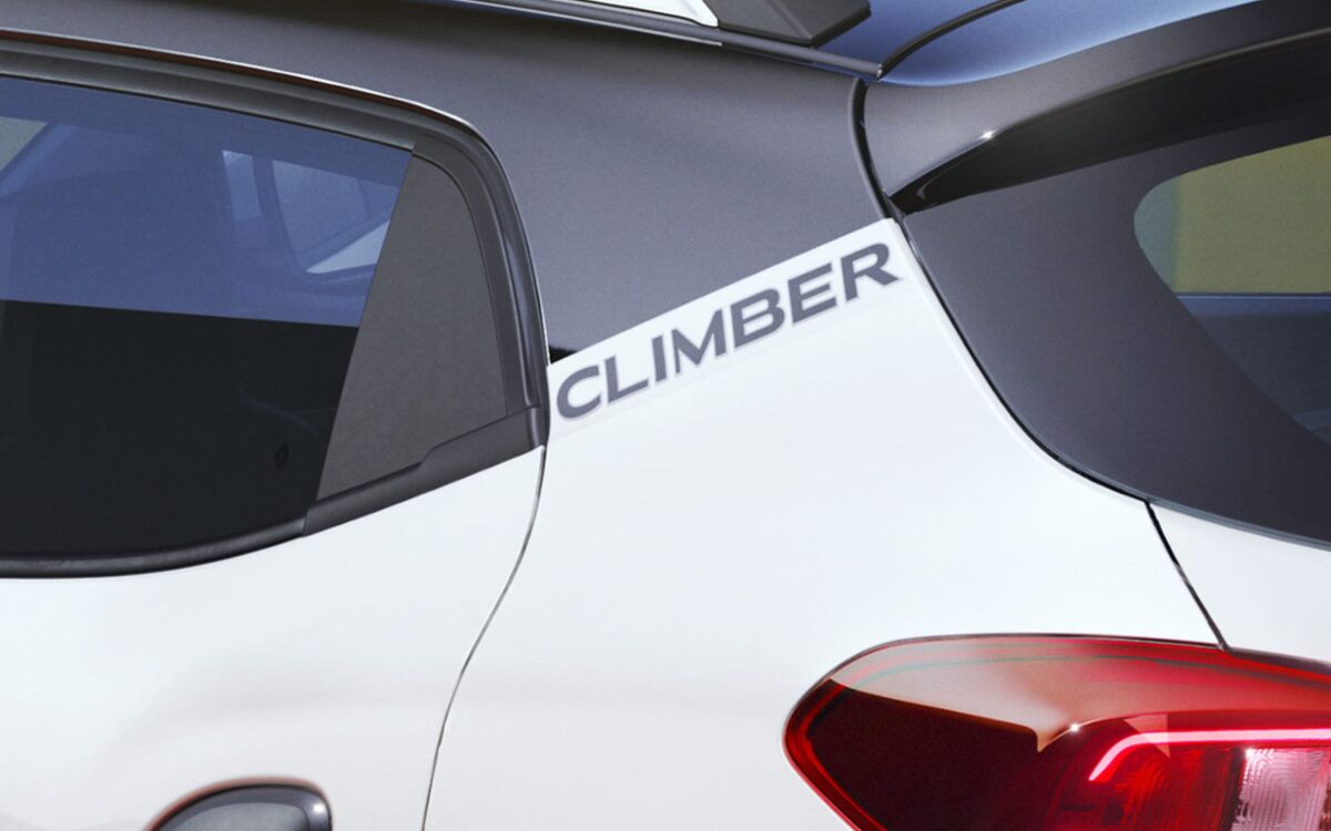 Rear corner of the Kwid Climber showing the tail lamp, Climber badge on the roof pillar and black roof