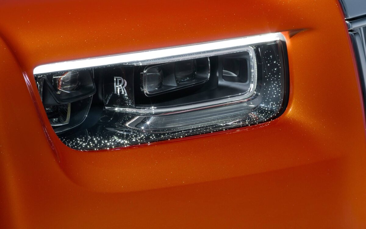 Close-up of the Phantom headlamp with its light strip in orange paint