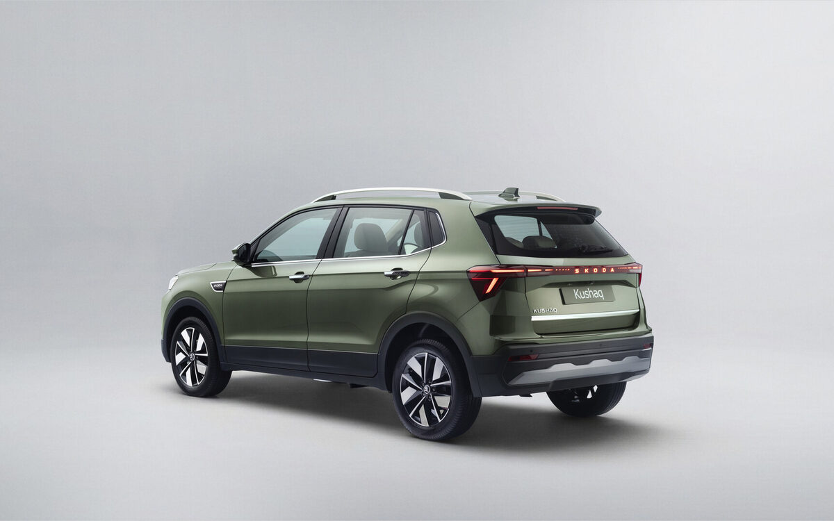 Updated Skoda Kushaq in olive green, rear three-quarter view in a studio