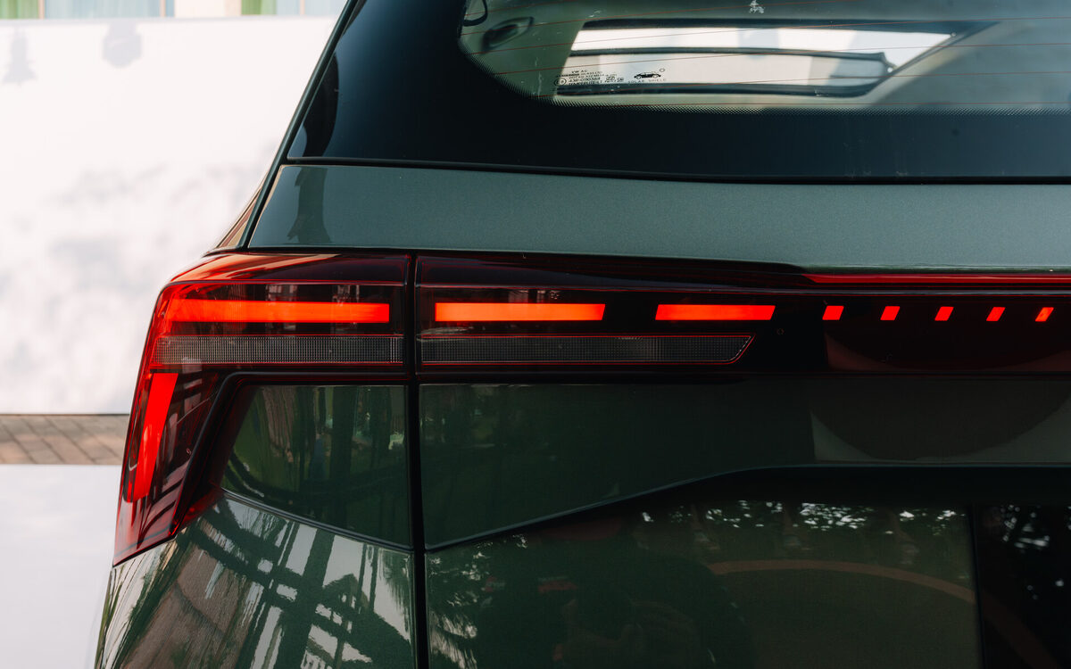 Close-up of the Skoda Kushaq light-bar tail lamp on a green body