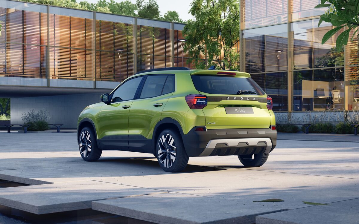 Skoda Kylaq in lime green, rear three-quarter view on a paved courtyard with tail lamps and rear bumper visible (cropped from a square press image)