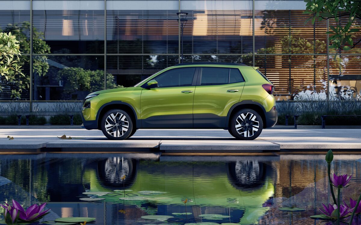 Skoda Kylaq in lime green, side profile beside a reflecting pool and glass building (cropped from a square press image)