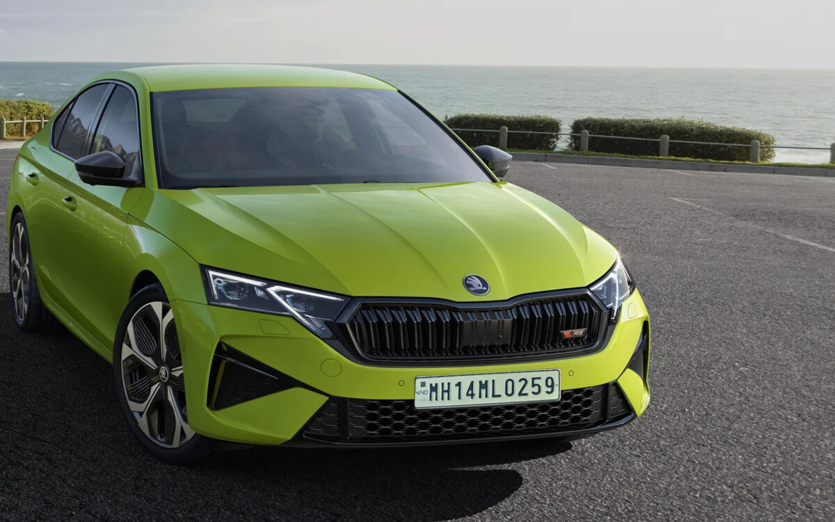 Skoda Octavia RS in Mamba Green, front three-quarter view on a coastal road