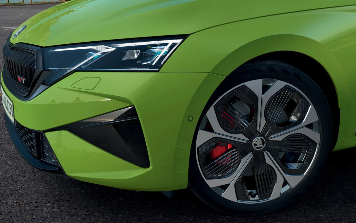Close-up of the Octavia RS matrix LED headlamp, RS grille and alloy wheel with red brake caliper