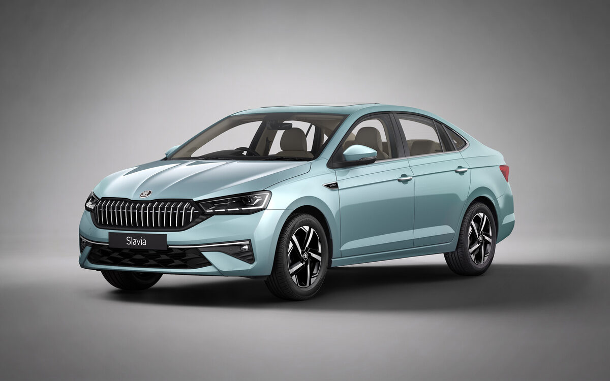 Updated Skoda Slavia in light blue, front three-quarter view in a studio