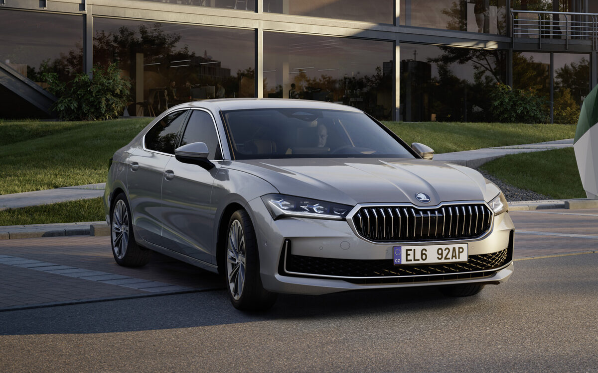 Silver Skoda Superb liftback, front three-quarter view on a paved street (cropped from a wider press image)