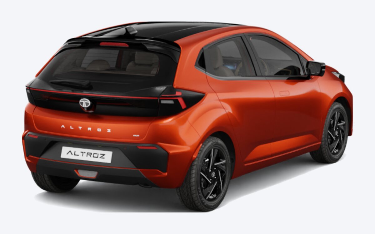 Tata Altroz in Ember Glow, rear three-quarter view showing the connected tail lamps