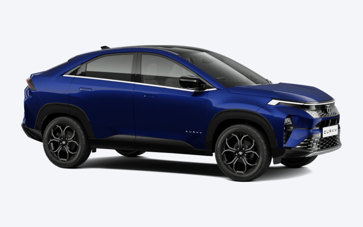 Tata Curvv in Opera Blue with a black roof, seen from the front side