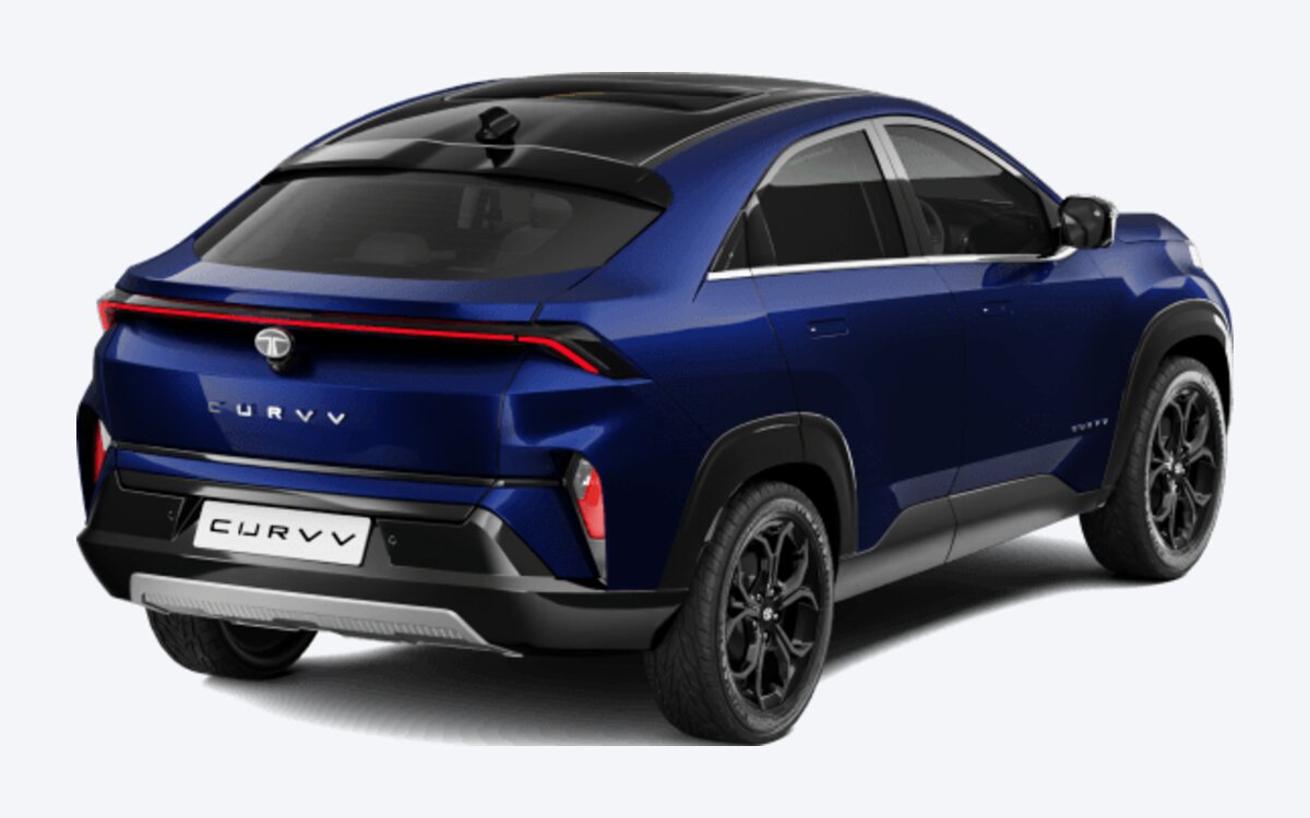 Tata Curvv in Opera Blue, rear three-quarter view showing the full-width tail lamp