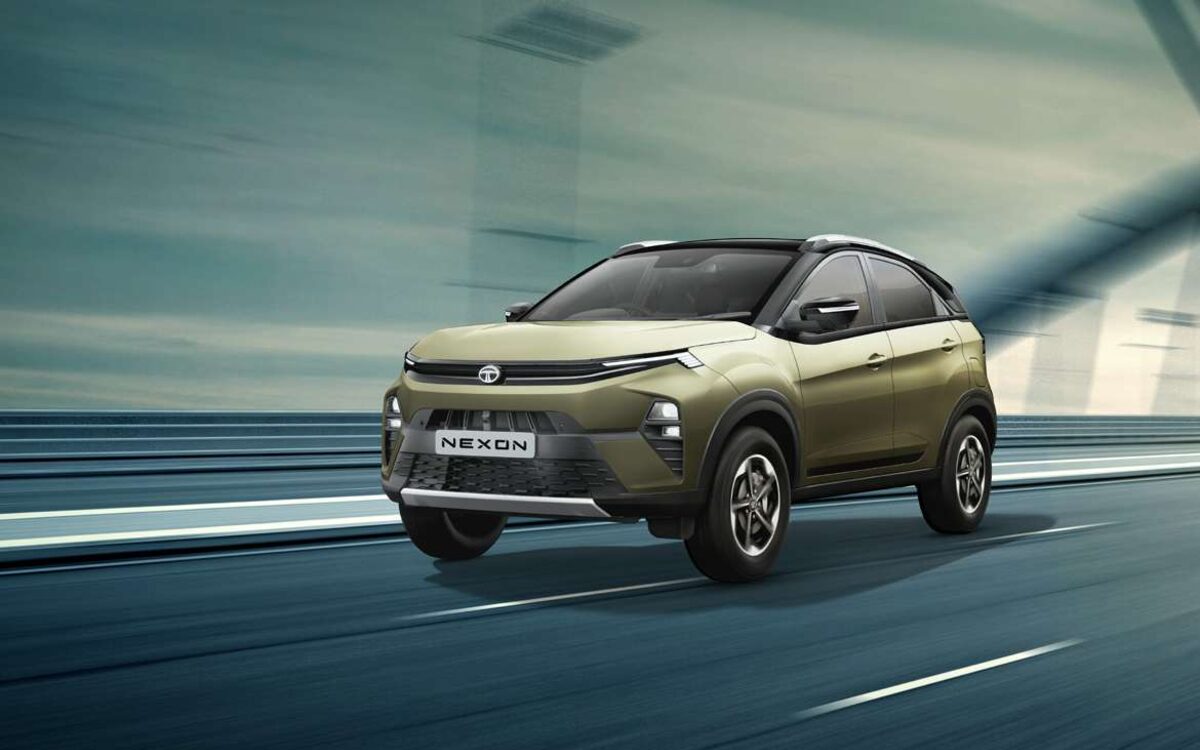 Tata Nexon in grassland beige driving at speed on an open road