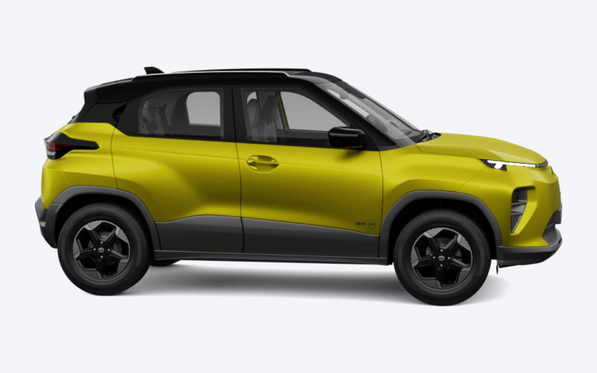 Tata Punch.ev in Fearless Yellow with a black roof, seen from the front side