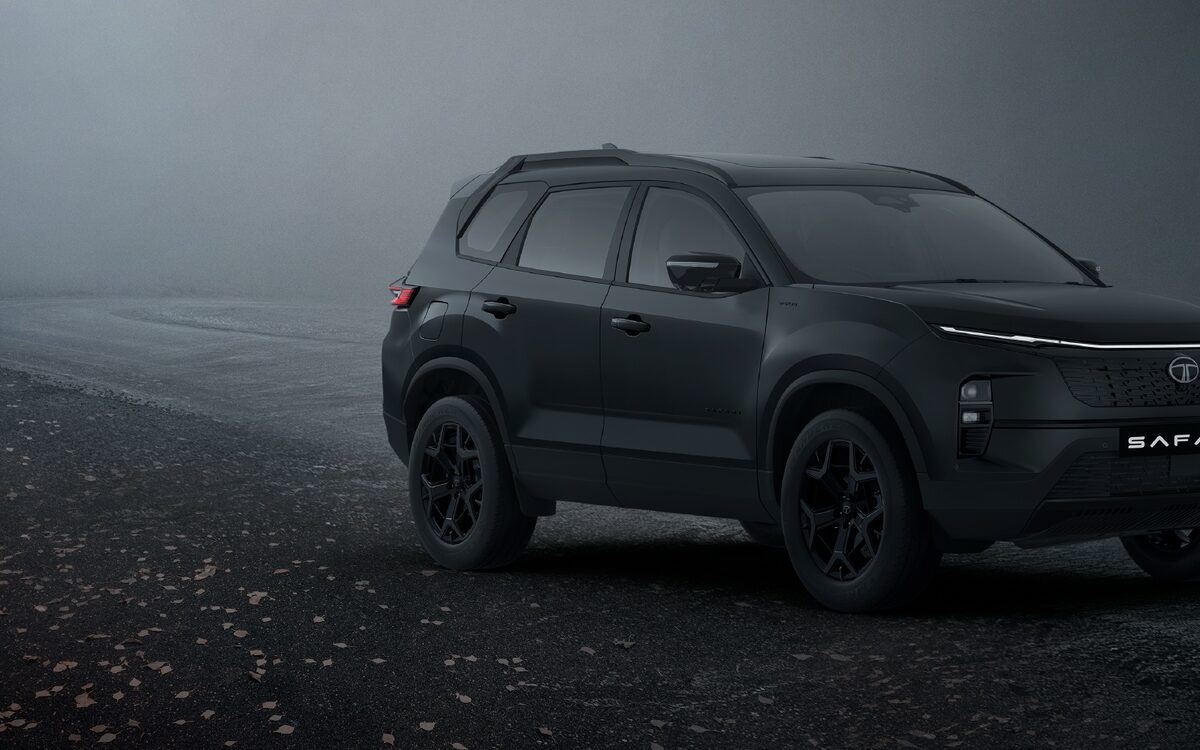 Tata Safari #DARK edition in black, front three-quarter view on a misty road