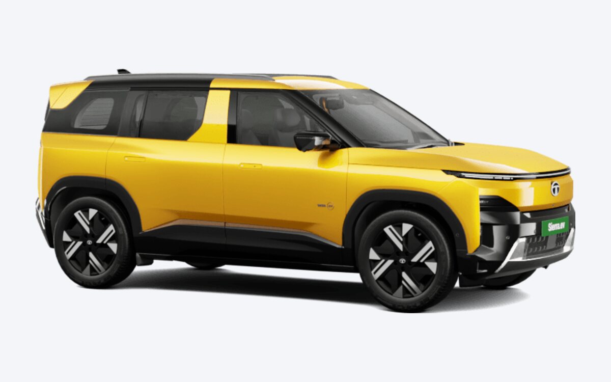 Tata Sierra.ev in Andaman Adventure yellow with a black roof, seen from the front side